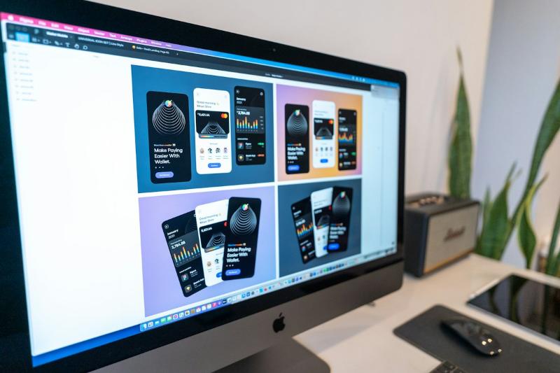 Website designs on a large desktop monitor